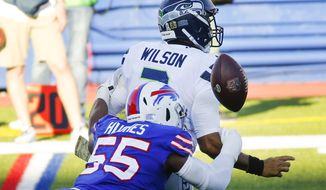 Buffalo Bills&#39; Jerry Hughes (55) knocks the ball away from Seattle Seahawks&#39; Russell Wilson (3) to force a fumble during the second half of an NFL football game Sunday, Nov. 8, 2020, in Orchard Park, N.Y. The Bills recovered the ball. (AP Photo/Jeffrey T. Barnes)