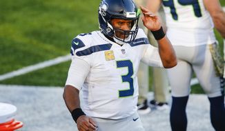 Seattle Seahawks quarterback Russell Wilson (3) reacts during the second half of an NFL football game against the Buffalo Bills Sunday, Nov. 8, 2020, in Orchard Park, N.Y. (AP Photo/John Munson)