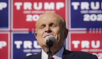 Former New York mayor Rudy Giuliani, a lawyer for President Donald Trump, pauses as he speaks during a news conference at Four Seasons Total Landscaping on legal challenges to vote counting in Pennsylvania, Saturday Nov. 7, 2020, in Philadelphia.