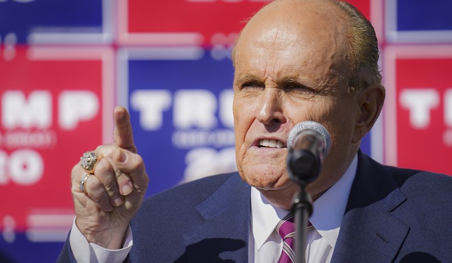 Former New York mayor Rudy Giuliani, a lawyer for President Donald Trump,speaks during a news conference at Four Seasons Total Landscaping on legal challenges to vote counting in Pennsylvania, Saturday Nov. 7, 2020, in Philadelphia.