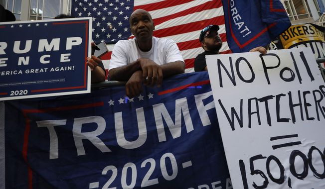 Supporters of President Donald Trump protest outside the Pennsylvania Convention Center in Philadelphia, Sunday, Nov. 8, 2020, a day after the 2020 election was called for Democrat Joe Biden.(AP Photo/Rebecca Blackwell)