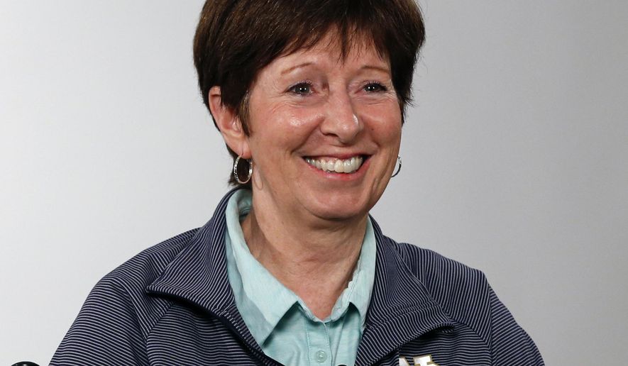 FILE - Notre Dame coach Muffet McGraw answers a question during the Atlantic Coast Conference women&#39;s NCAA college basketball media day in Charlotte, N.C., in this Oct. 3, 2019, file photo. Muffet McGraw has kept busy since retiring last spring from coaching Notre Dame. From teaching a sports business leadership class at the university to helping on Election Day as a poll worker, the Hall of Famer women&#39;s basketball coach has stayed active. Now she&#39;s ready to add a new job to her list, serving as a studio analyst for the ACC Network.(AP Photo/Nell Redmond, File)