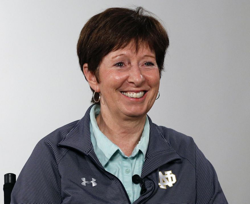 FILE - Notre Dame coach Muffet McGraw answers a question during the Atlantic Coast Conference women's NCAA college basketball media day in Charlotte, N.C., in this Oct. 3, 2019, file photo. Muffet McGraw has kept busy since retiring last spring from coaching Notre Dame. From teaching a sports business leadership class at the university to helping on Election Day as a poll worker, the Hall of Famer women's basketball coach has stayed active. Now she's ready to add a new job to her list, serving as a studio analyst for the ACC Network.(AP Photo/Nell Redmond, File)