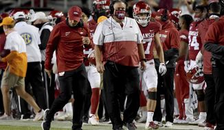 Arkansas coach Sam Pittman walks the sideline during the first half of the team&#39;s NCAA college football game against Tennessee on Saturday, Nov. 7, 2020, in Fayetteville, Ark. (AP Photo/Michael Woods)