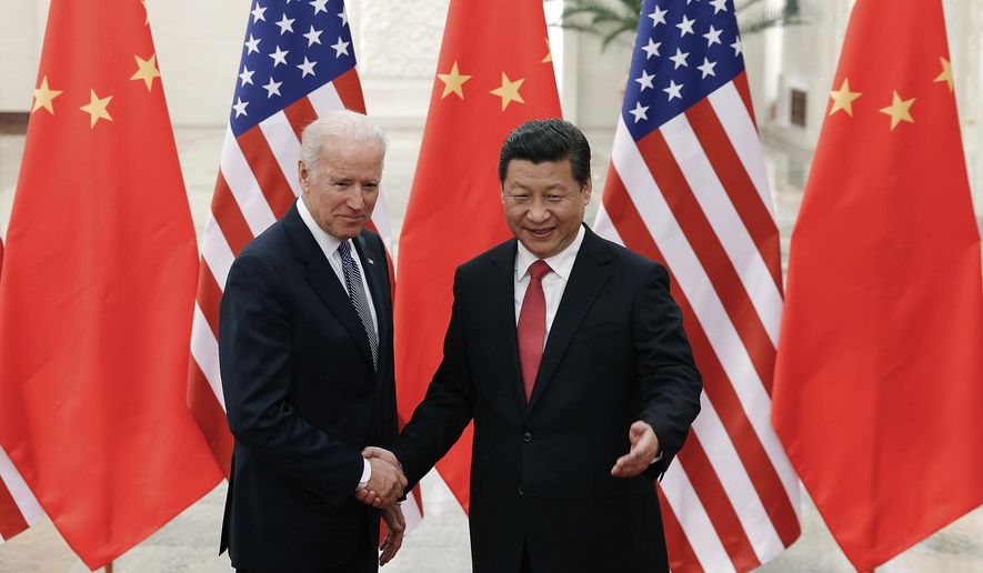 As vice president, Joseph R. Biden visited Chinese President Xi Jinping in Beijing. He called for intimate U.S. economic and trade integration with the emerging communist power. (Associated Press/File)