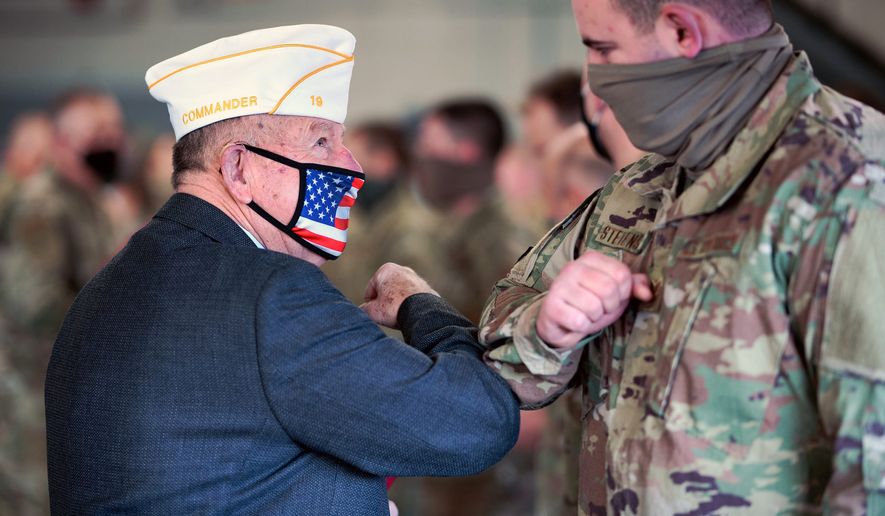American Legion State Commander Ron Larose and Northern Area Commander Tom Scanlon share an elbow bump after honoring airmen with the 158th Fighter Wing, Vermont Air National Guard. (Air National Guard)