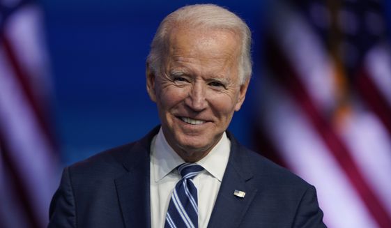 President-elect Joe Biden smiles as he speaks Tuesday, Nov. 10, 2020, at The Queen theater in Wilmington, Del. (AP Photo/Carolyn Kaster) ** FILE **
