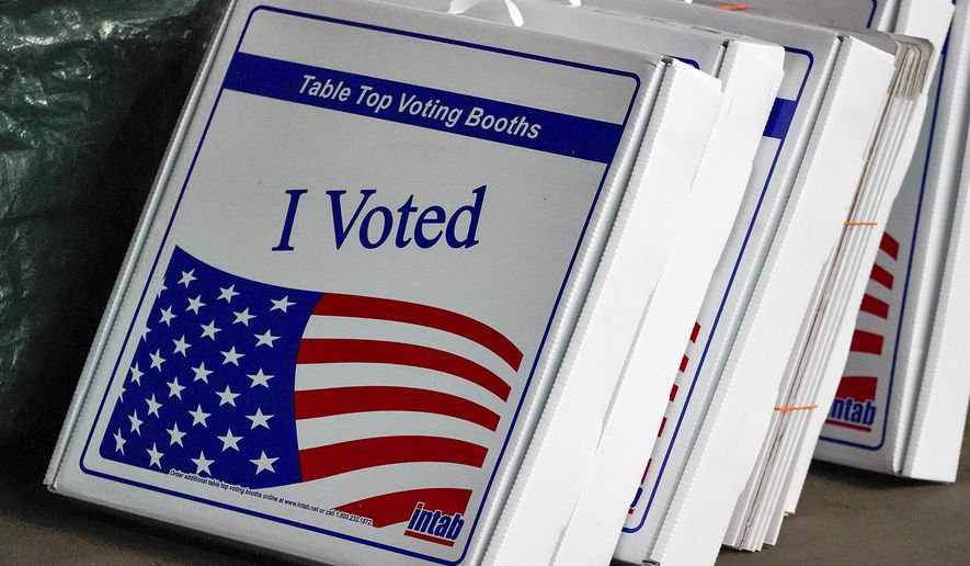 Table top voting booths are stored at the Allegheny County Election Division warehouse on the Northside of Pittsburgh, Friday, Nov. 6, 2020. (AP Photo/Gene J. Puskar)