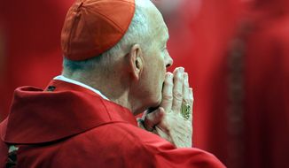 In this April 18, 2005, file photo, U.S. Cardinal Theodore Edgar McCarrick attends a Mass in St. Peter&#x27;s Basilica at the Vatican, as the cardinals who will elect a new Pope made their last public appearance before sequestering themselves inside the Sistine Chapel later in the day. Thousands of pilgrims and tourists packed St. Peter&#x27;s Basilica and the square to take a last glimpse at the cardinals who elected the next head of the Roman Catholic Church during the Conclave. (AP Photo/Pier Paolo Cito, File)