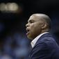 FILE - In this Jan. 2, 2019, file photo, Harvard head coach Tommy Amaker reacts during an NCAA college basketball game against North Carolina in Chapel Hill, N.C. When George Floyd died this spring under a policeman&#39;s knee, Amaker didn&#39;t send out a tweet affirming Black Lives Matter or add a uniform patch calling for Equality. He simply continued exposing his players to social justice issues, as he had been doing for more than a decade, establishing the program as a model for other teams only now showing an interest. (AP Photo/Gerry Broome, file)