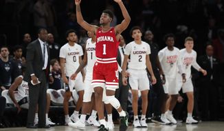 FILE - Indiana guard Al Durham (1) celebrates at the end of an NCAA college basketball game against Connecticut in the Jimmy V Classic in New York, in this Wednesday, Dec. 11, 2019, file photo. Durham was Indiana&#39;s most consistent 3-point shooter last season. (AP Photo/Kathy Willens, File)