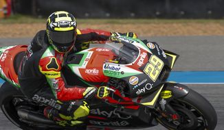 FILE - In this file photo dated Saturday, Oct. 5, 2019, Italy&#39;s rider Andrea Iannone of the Aprilia Racing Team Gresini during a qualifying round of Thailand&#39;s MotoGP race at the Chang International Circuit in Buriram, Thailand.  MotoGP rider Andrea Iannone has had his ban for doping with an anabolic steroid extended to four years by the Court of Arbitration for Sport Tuesday Nov. 10, 2020, because he could not prove contaminated meat was to blame. (AP Photo/Gemunu Amarasinghe, FILE)