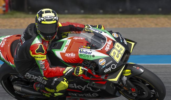 FILE - In this file photo dated Saturday, Oct. 5, 2019, Italy&#x27;s rider Andrea Iannone of the Aprilia Racing Team Gresini during a qualifying round of Thailand&#x27;s MotoGP race at the Chang International Circuit in Buriram, Thailand.  MotoGP rider Andrea Iannone has had his ban for doping with an anabolic steroid extended to four years by the Court of Arbitration for Sport Tuesday Nov. 10, 2020, because he could not prove contaminated meat was to blame. (AP Photo/Gemunu Amarasinghe, FILE)
