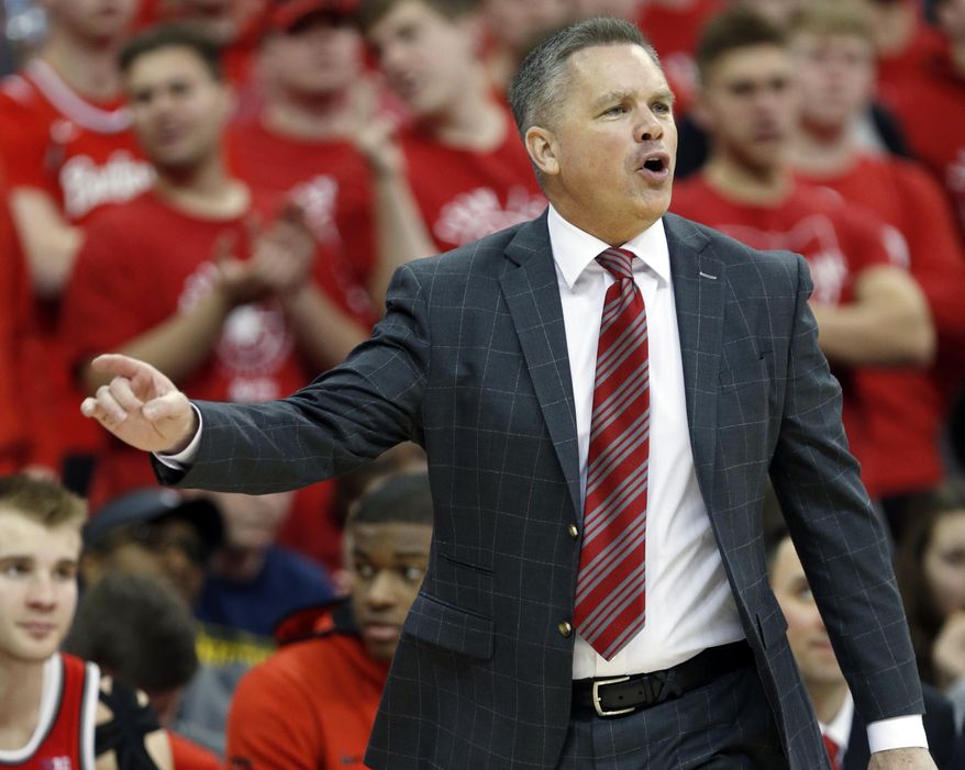 FILE - In this March 1, 2020, file photo, Ohio State coach Chris Holtmann directs his team against Michigan during the second half of an NCAA college basketball game in Columbus, Ohio. Transfer rules have generated a lot of comings and goings in the Ohio State basketball program. Add a preseason practice schedule affected by COVID-19 restrictions, and it’s no wonder coach Chris Holtmann is still trying to figure out where all the pieces will fit. (AP Photo/Paul Vernon, File)