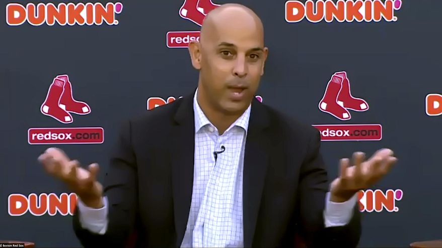 In this still image from an online video news conference provided by the Boston Red Sox, manager Alex Cora speaks Tuesday, Nov. 10, 2020, at Fenway Park in Boston. Cora, who led the Red Sox to the 2018 World Series title, was rehired as manager less than a year after the team let him go because of his role in the Houston Astros&#39; cheating scandal. (Boston Red Sox via AP)