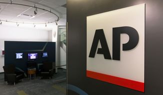FILE - This Tuesday, April 26, 2016 file photo shows The Associated Press logo in New York. The Associated Press has pulled out of its planned coverage of Wednesday&#39;s CMA Awards show due to a dispute over photographs of the broadcast.  (AP Photo/Hiro Komae, File)