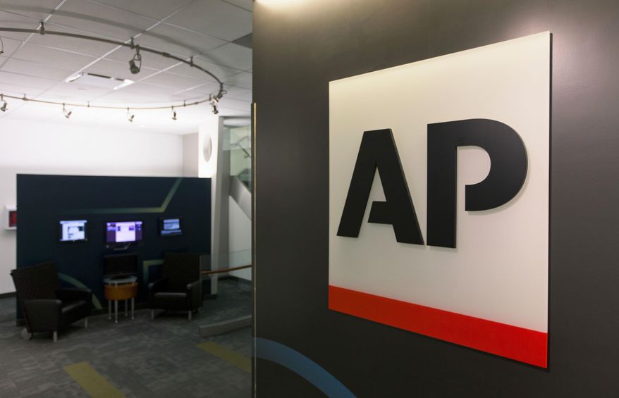 FILE - This Tuesday, April 26, 2016 file photo shows The Associated Press logo in New York. The Associated Press has pulled out of its planned coverage of Wednesday's CMA Awards show due to a dispute over photographs of the broadcast. (AP Photo/Hiro Komae, File)