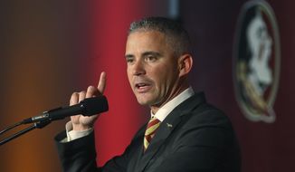 FILE - In this Sunday, Dec. 8, 2019, file photo, Florida State head football coach Mike Norvell speaks at a news conference in Tallahassee, Fla. Florida State&#39;s struggles continue to mount. On Wednesday, Nov. 11, 2020, the Seminoles lost several players for the rest of the season, some to injuries and others say it is time to move on. (AP Photo/Phil Sears, File)