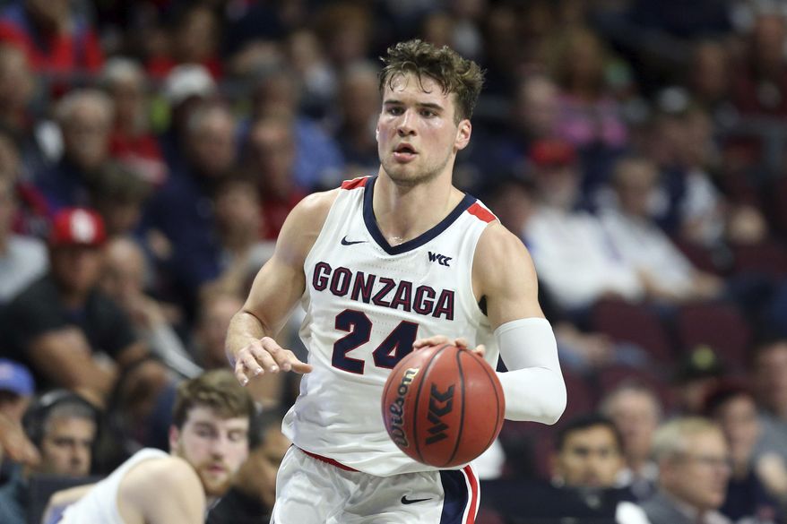 FILE - In this March 9, 2020, file photo, Gonzaga's Corey Kispert plays against San Francisco during the first half of an NCAA college basketball game in the West Coast Conference men's tournament in Las Vegas. Kispert has made The Associated Press 2020-21 preseason All-America team, announced Wednesday, Nov. 11. (AP Photo/Isaac Brekken, File)
