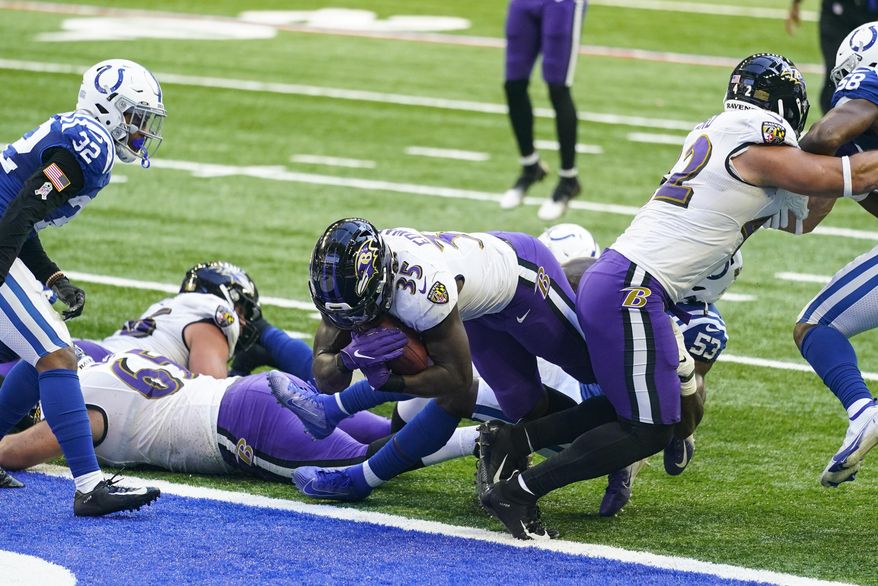 Baltimore Ravens running back Gus Edwards (35) dives in for a touchdown against the Indianapolis Colts in the second half of an NFL football game in Indianapolis, Sunday, Nov. 8, 2020. (AP Photo/Darron Cummings)