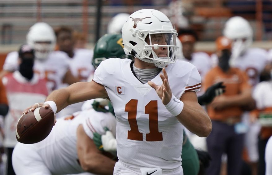 FILE - In this Oct. 24, 2020, file photo, Texas' Sam Ehlinger looks to pass against Baylor during the first half of an NCAA college football game in Austin, Texas. Kansas State and Texas Tech changed starting quarterbacks midseason for much different reasons. While true freshman quarterbacks are now starting for the two Big 12 teams in the Sunflower State of Kansas, and No. 18 Oklahoma is led by redshirt freshman Spencer Rattler, the senior seasons for Sam Ehlinger at No. 21 Texas and Charlie Brewer at Baylor don't necessarily have to be the end of their college careers. (AP Photo/Chuck Burton, File)
