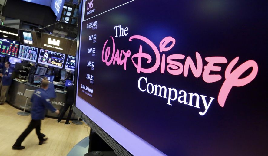 FILE - In this Aug. 8, 2017, file photo, The Walt Disney Co. logo appears on a screen above the floor of the New York Stock Exchange. The Walt Disney Co. has “dramatically” slashed its advertising budget on Facebook and Facebook-owned Instagram, according to a report in the Wall Street Journal.  (AP Photo/Richard Drew, File)
