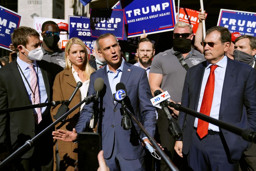 President Donald Trump&#39;s campaign advisor Corey Lewandowski, center, speaks outside the Pennsylvania Convention Center where votes are being counted, Thursday, Nov. 5, 2020, in Philadelphia, following Tuesday&#39;s election. At left is former Florida Attorney General Pam Bondi. (AP Photo/Matt Slocum)