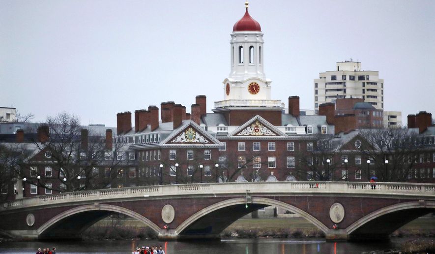 In this March 7, 2017, file photo, rowers paddle along the Charles River past the Harvard University campus in Cambridge, Mass. (AP Photo/Charles Krupa, File)  **FILE**