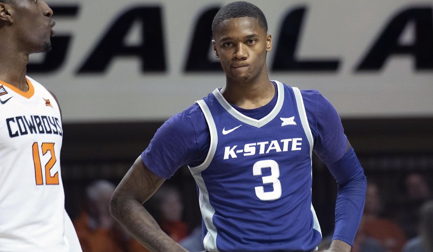 FILE - Kansas State guard DaJuan Gordon (3) and Oklahoma State forward Cameron McGriff (12) await a free throw during an NCAA college basketball game in Stillwater, Okla., in this Wednesday, March 4, 2020, file photo. Kansas lost their top three scorers from last season. Gordon has only a freshman season of lumps on his resume. (AP Photo/Brody Schmidt, File)