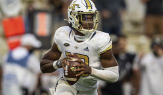 FILE - In this Saturday, Sept 19, 2020, file photo, Georgia Tech quarterback Jeff Sims (10) looks to pass against UCF during an NCAA college football game in Atlanta. Pitt&#39;s fierce pass rush will be a new test for Sims&#39; ability to remain poised in the pocket on Saturday night. (AP Photo/Danny Karnik, File)