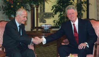 In this March 26, 2000, file photo, U.S. President Bill Clinton, right, shakes hands with Syrian President Hafez Assad, at the opening of their meeting, in Geneva, Switzerland. On Nov. 13, 1970, Assad a young career air force officer launched a bloodless coup. Fifty years later, Hafez Assad’s family still rules Syria. The country is in ruins from a decade of civil war that killed around a half million people, displaced half the population and virtually wiped out the economy. But Hafez’s son, Bashar Assad, has an unquestioned grip on what remains. (AP Photo/Laurent Gillieron, File)
