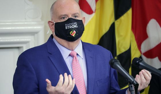 Maryland Gov. Larry Hogan takes questions from journalists during a news conference on Thursday, Nov. 12, 2020 in Annapolis, Md., where the governor announced how about $70 million in federal money will be used to help fight the virus. (AP Photo/Brian Witte)