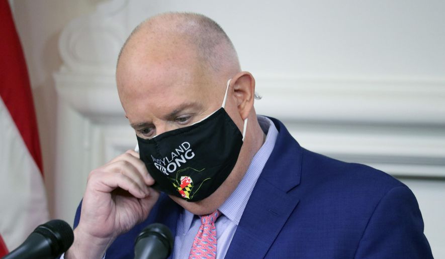 Maryland Gov. Larry Hogan gets ready to take questions from journalists during a news conference on Thursday, Nov. 12, 2020 in Annapolis, Md., where the governor announced how about $70 million in federal money will be used to help fight the virus. (AP Photo/Brian Witte)