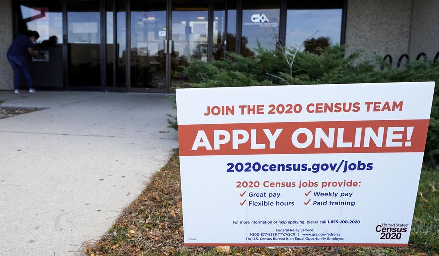 A sign is seen outside of IDES (Illinois Department of Employment Security) WorkNet center in Arlington Heights, Ill., Thursday, Nov. 5, 2020. Illinois reports biggest spike in unemployment claims of all states. (AP Photo/Nam Y. Huh)