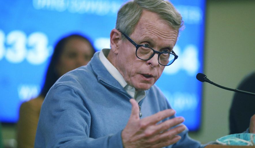 In this photo from March 14, 2020, Ohio Gov. Mike DeWine speaks at a coronavirus news conference at the Ohio Statehouse in Columbus, Ohio. (Doral Chenoweth/The Columbus Dispatch via AP) **FILE**