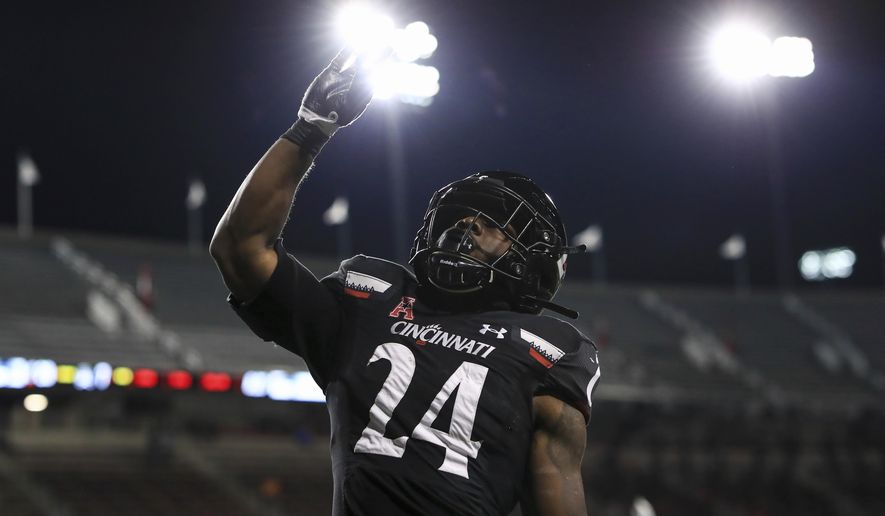 Cincinnati running back Jerome Ford celebrates his touchdown during the first half of the team&#x27;s NCAA college football game against East Carolina, Friday, Nov. 13, 2020, in Cincinnati. (AP Photo/Aaron Doster)