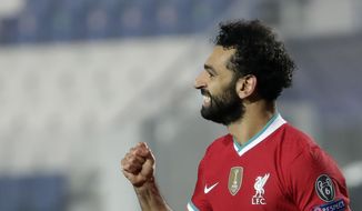 FILE - Liverpool&#x27;s Mohamed Salah celebrates his goal against Atalanta during the Champions League, group D soccer match between Atalanta and Liverpool, at the Gewiss Stadium in Bergamo, Italy, Tuesday, Nov. 3, 2020. Salah has tested positive for the coronavirus. The announcement was made by the Egyptian soccer association on Twitter, Friday, Nov. 13,  ahead of Saturday’s game against Togo. (AP Photo/Luca Bruno)
