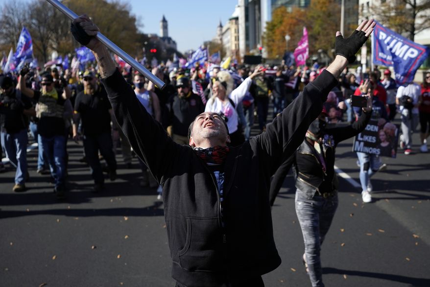 Supporters of President Donald Trump attend a pro-Trump march Saturday, Nov. 14, 2020, in Washington. (AP Photo/Julio Cortez)