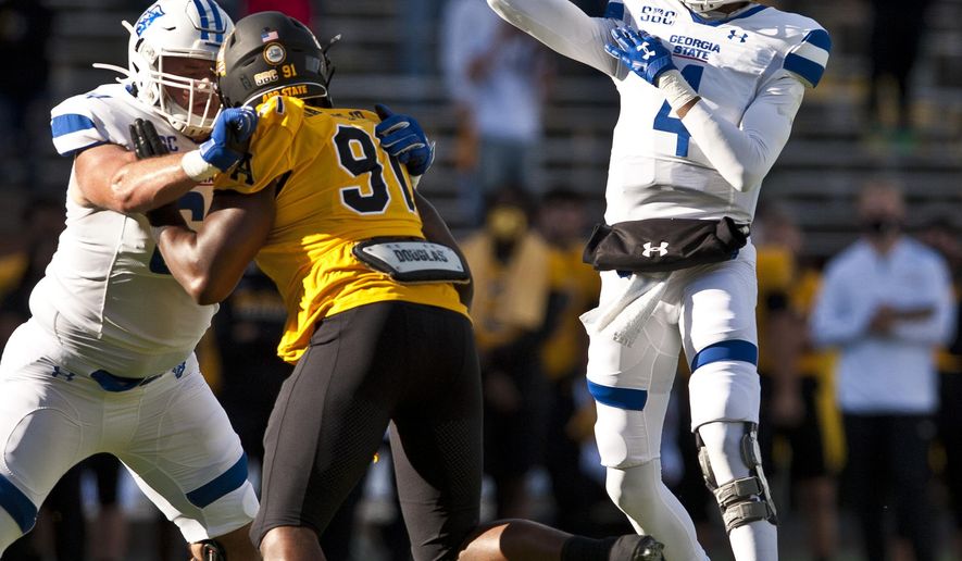 Georgia State quarterback Cornelious Brown IV throws in the first half during an NCAA football game, against Appalachian State Saturday, Nov. 14, 2020, in Boone, N.C. (Walt Unks/Winston-Salem Journal via AP)