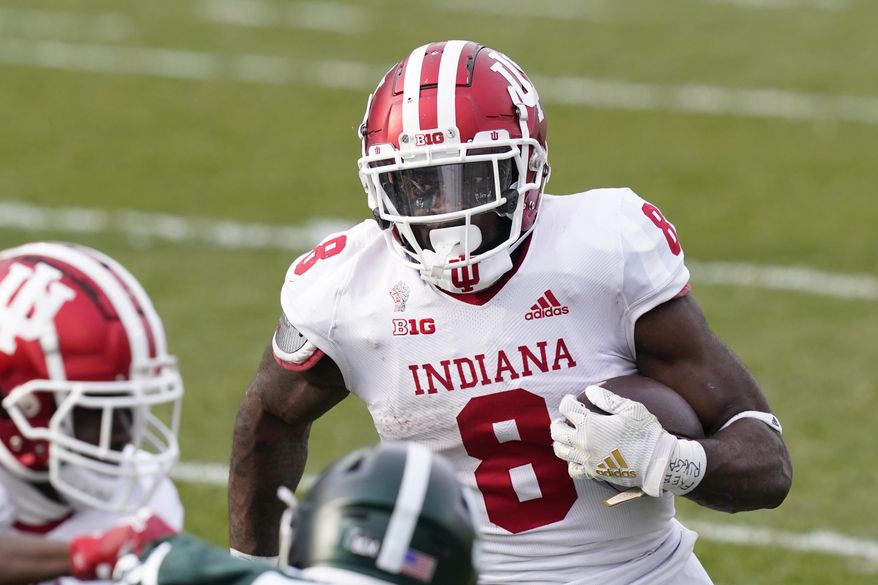 Indiana running back Stevie Scott III rushes during the second half of an NCAA college football game against Michigan State, Saturday, Nov. 14, 2020, in East Lansing, Mich. (AP Photo/Carlos Osorio)