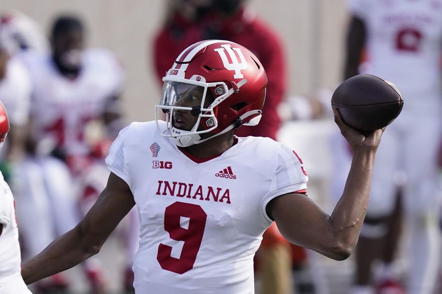 Indiana quarterback Michael Penix Jr. throws during the first half of an NCAA college football game against Michigan State, Saturday, Nov. 14, 2020, in East Lansing, Mich. (AP Photo/Carlos Osorio)
