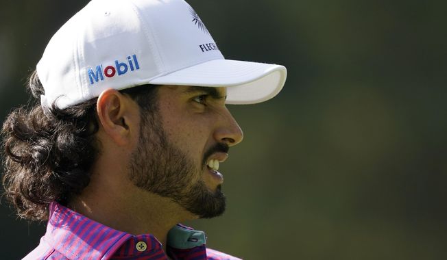 Abraham Ancer, of Mexico, watches his tee shot on the sixth hole during the third round of the Masters golf tournament Saturday, Nov. 14, 2020, in Augusta, Ga. (AP Photo/Charlie Riedel)