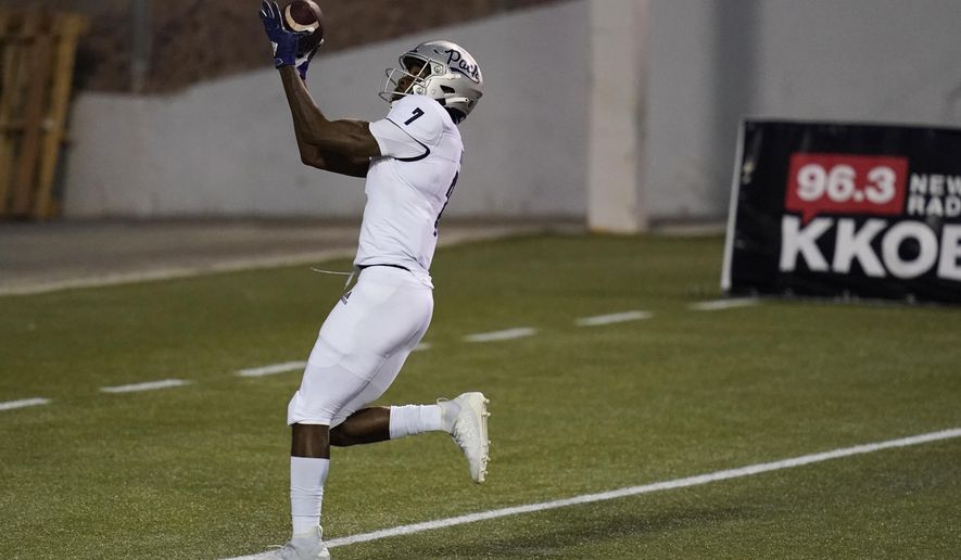 Nevada wide receiver Romeo Doubs (7) makes a touchdown catch against New Mexico during the first half of an NCAA college football game Saturday, Nov. 14, 2020, in Las Vegas. (AP Photo/John Locher)