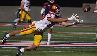 Southern California wide receiver Drake London (15) dives for the ball in the first half of an NCAA college football game against Arizona, Saturday, Nov. 14, 2020, in Tucson, Ariz. (AP Photo/Rick Scuteri)