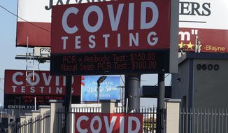 Advertisements for Covid-19 testing ares posted outside Los Angeles International Airport in Los Angeles, Friday, Nov. 13, 2020. California has become the second state to record 1 million confirmed coronavirus infections. The governors of California, Oregon and Washington issued travel advisories Friday, Nov. 13, 2020, urging people entering their states or returning from outside the states to self-quarantine to slow the spread of the coronavirus, California Gov. Gavin Newsom&#x27;s office said. The advisories urge people to avoid non-essential out-of-state travel, ask people to self-quarantine for 14 days after arriving from another state or country and encourage residents to stay local, a statement said. (AP Photo/Damian Dovarganes)