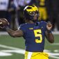 Michigan quarterback Joe Milton throws a pass during the first quarter of the team&#39;s NCAA college football game against Wisconsin in Ann Arbor, Mich., Saturday, Nov. 14, 2020. (AP Photo/Tony Ding)