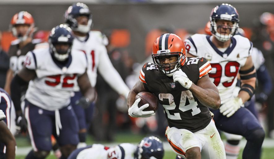 Cleveland Browns running back Nick Chubb (24) rushes for a 9-yard touchdown during the second half of an NFL football game against the Houston Texans, Sunday, Nov. 15, 2020, in Cleveland. (AP Photo/Ron Schwane)