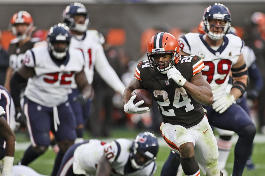 Cleveland Browns running back Nick Chubb (24) rushes for a 9-yard touchdown during the second half of an NFL football game against the Houston Texans, Sunday, Nov. 15, 2020, in Cleveland. (AP Photo/Ron Schwane)