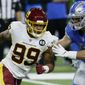 Washington Football Team defensive end Chase Young (99) rushes against Detroit Lions tight end Jesse James (83) during the first half of an NFL football game, Sunday, Nov. 15, 2020, in Detroit. (AP Photo/Duane Burleson)