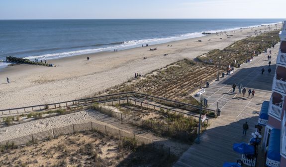 In this file photo, the beach and boardwalk are seen, Friday, Nov. 13, 2020, in Rehoboth Beach, Del. President Joe Biden owns a $2.7 million, Delaware North Shores home with a swimming pool that overlooks Cape Henlopen State Park, is blocks from the ocean and a short drive from downtown Rehoboth Beach. In September 2021, DHS doled out a $455,000 contract to a Sussex County, Delaware, construction company to build a fence around the president’s “Summer White House,” according to USAspending.gov, an online database that tracks government spending. (AP Photo/Alex Brandon)  **FILE**